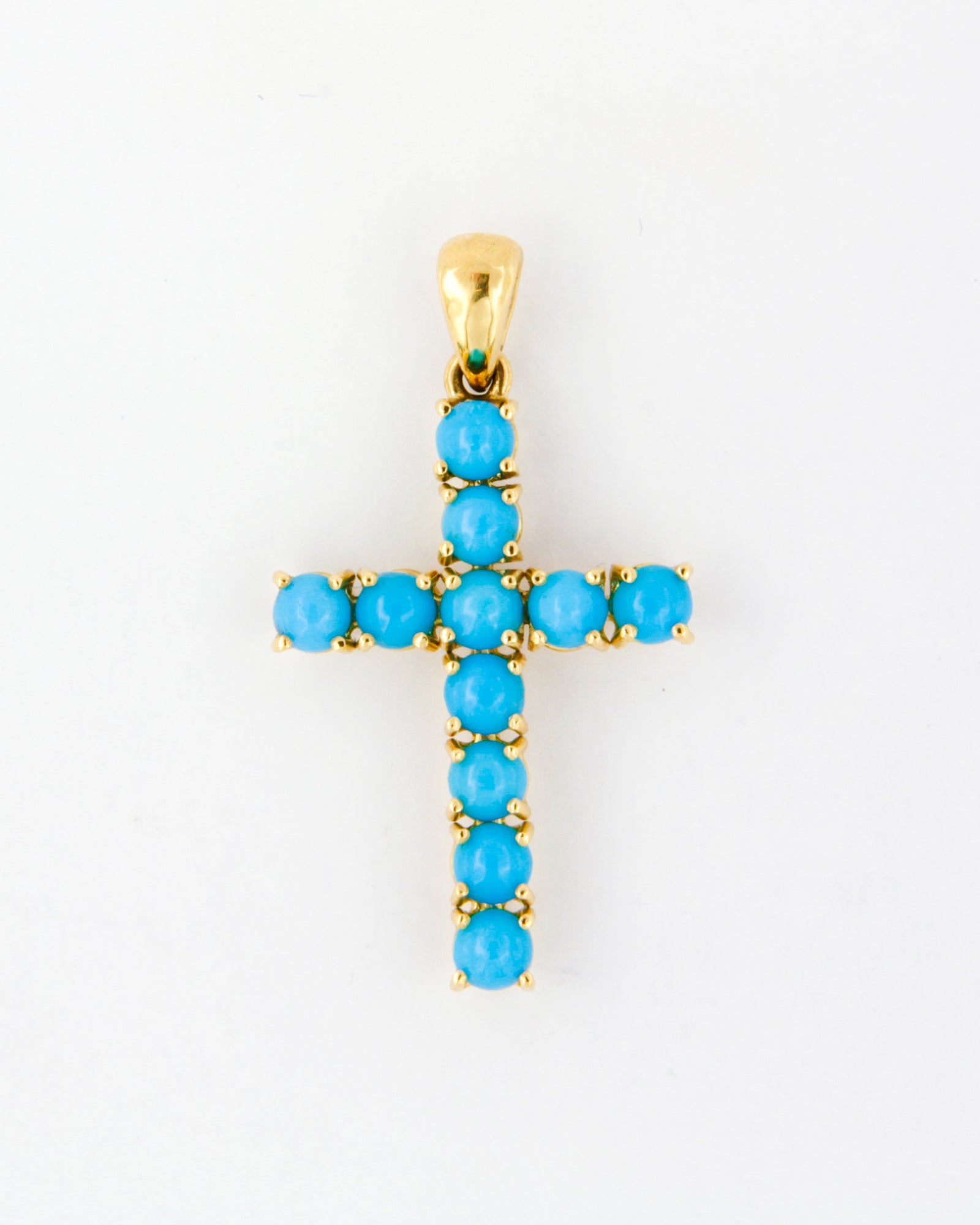 Ciondolo croce in oro giallo 18 carati con semisfere di turchese.