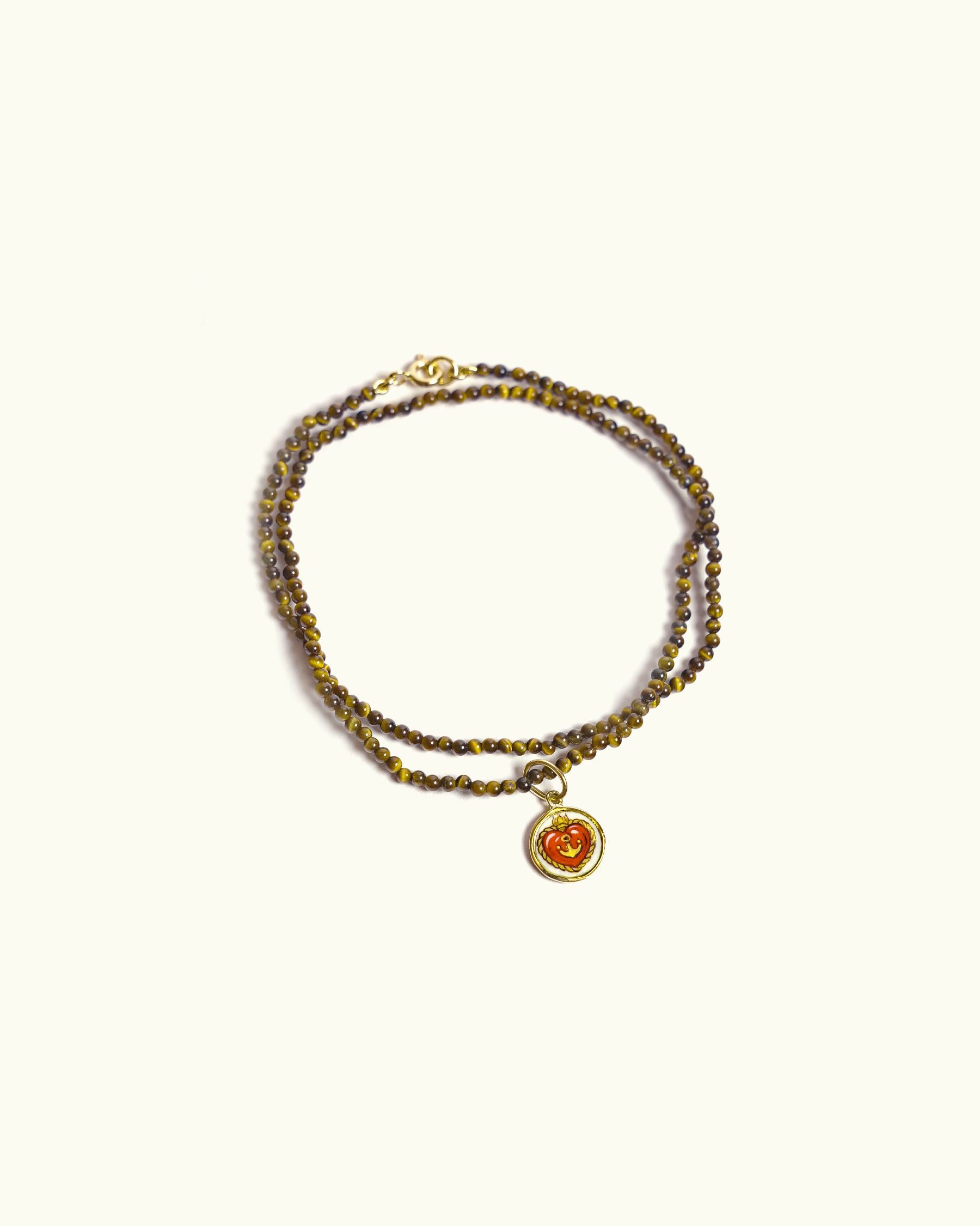 Collana Coloris in occhio di tigre con piastra in oro giallo 18K e cuore dipinto a mano in smalto a fuoco