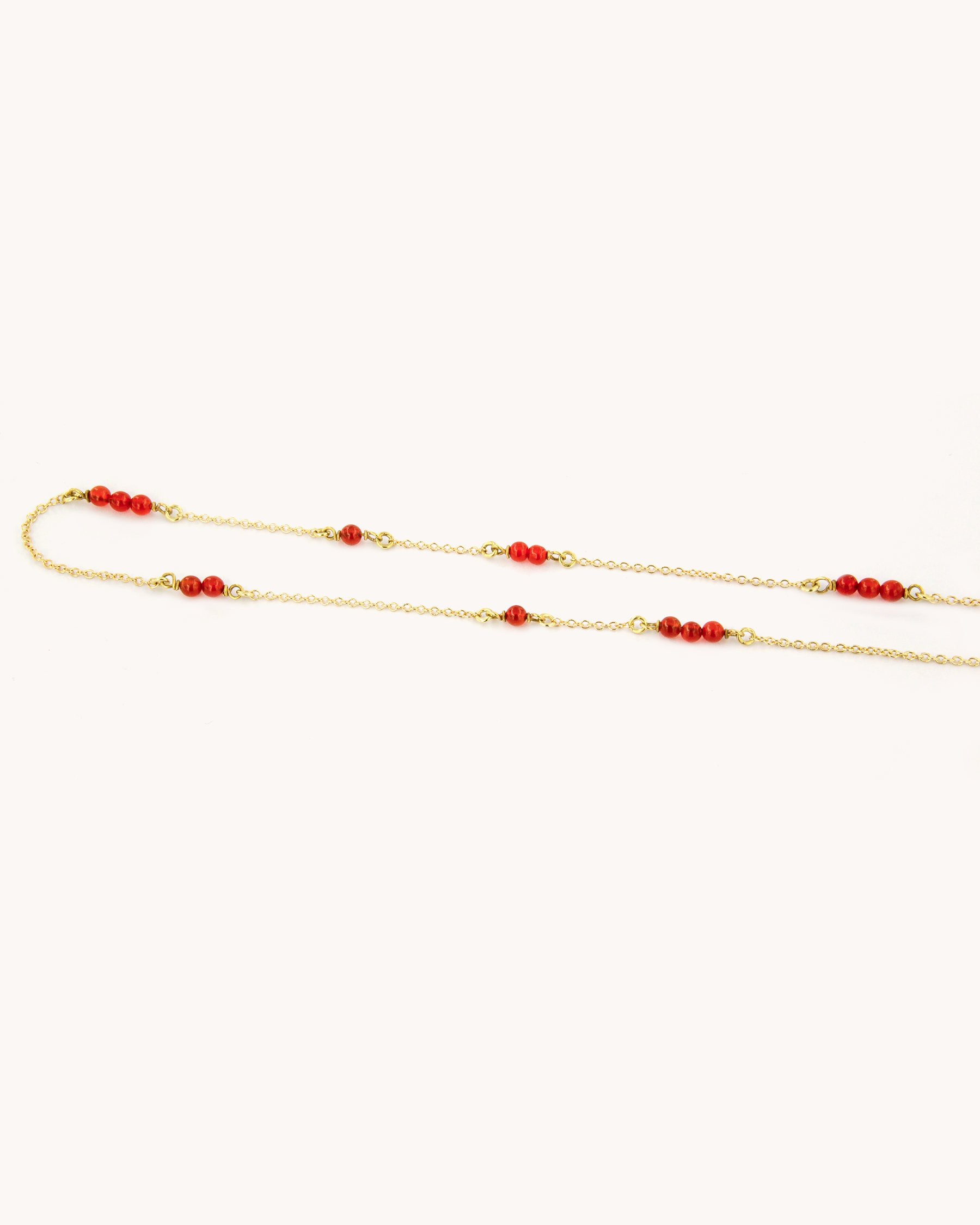 Collana in oro giallo 18 carati con perline di corniola