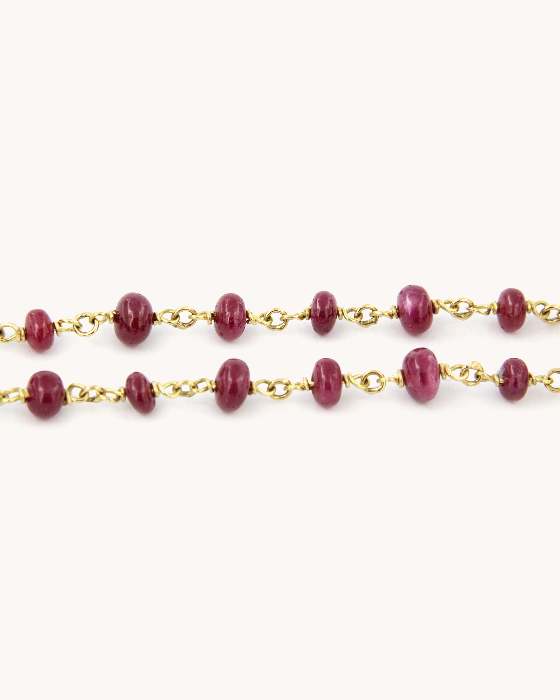 Collana Mediterraneo in oro 18 carati con radici di rubini disposte in sequenza mista