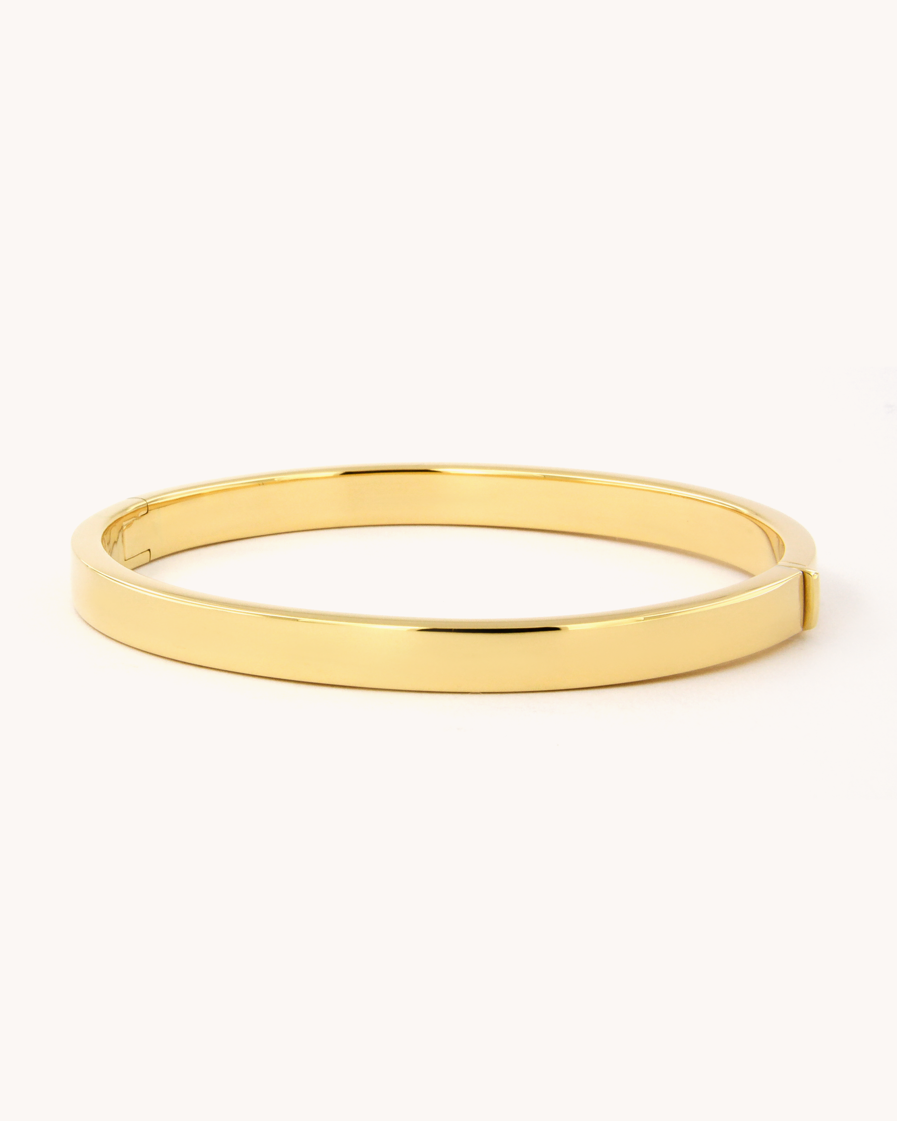 Bracciale rigido a fascia in oro giallo 18 carati