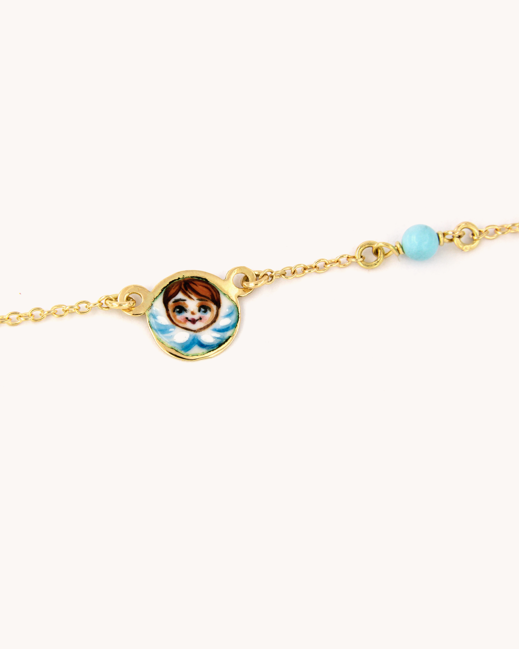 Collana Angelo Blu in oro giallo 18 carati con smalto a fuoco e perlina in pasta di turchese